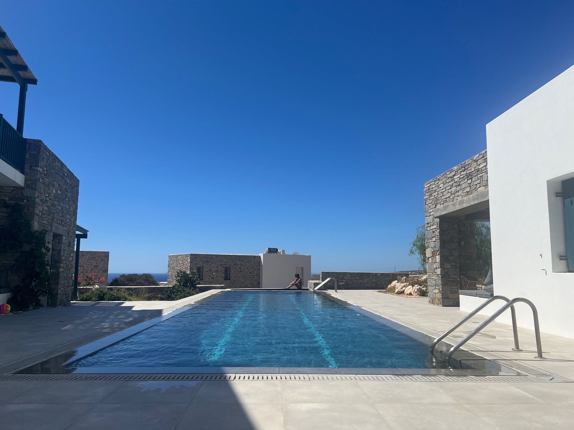 Garden Suite — shared infinity pool overlooking the aegean