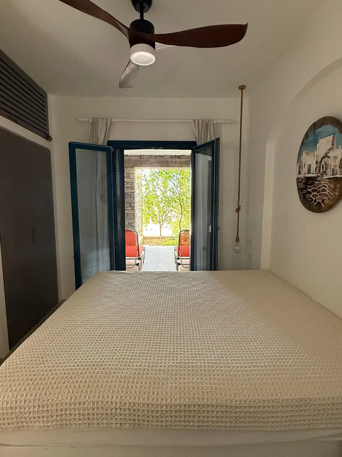 Garden Suite — bedroom view towards private patio