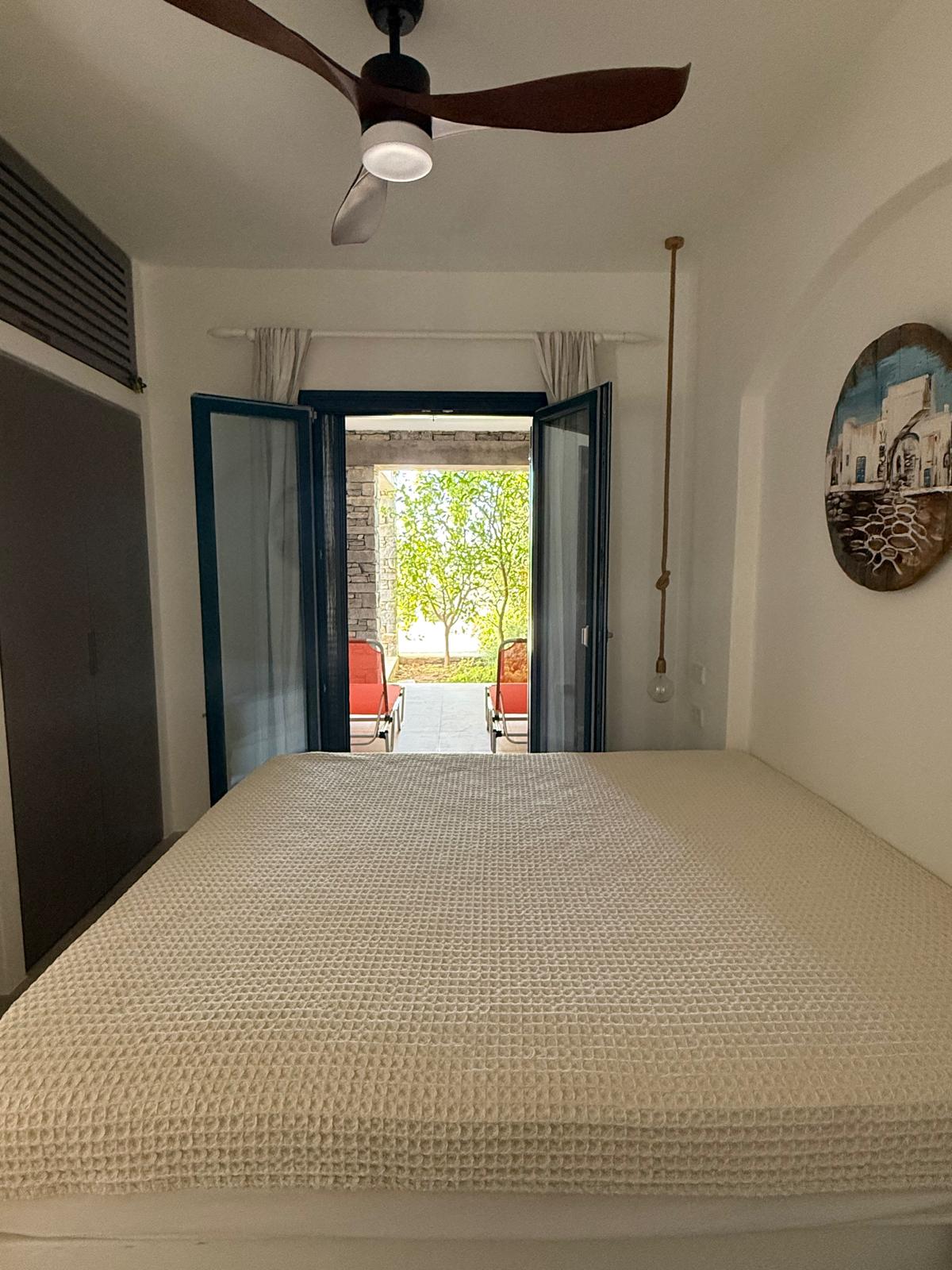 Garden Suite — bedroom view towards private patio