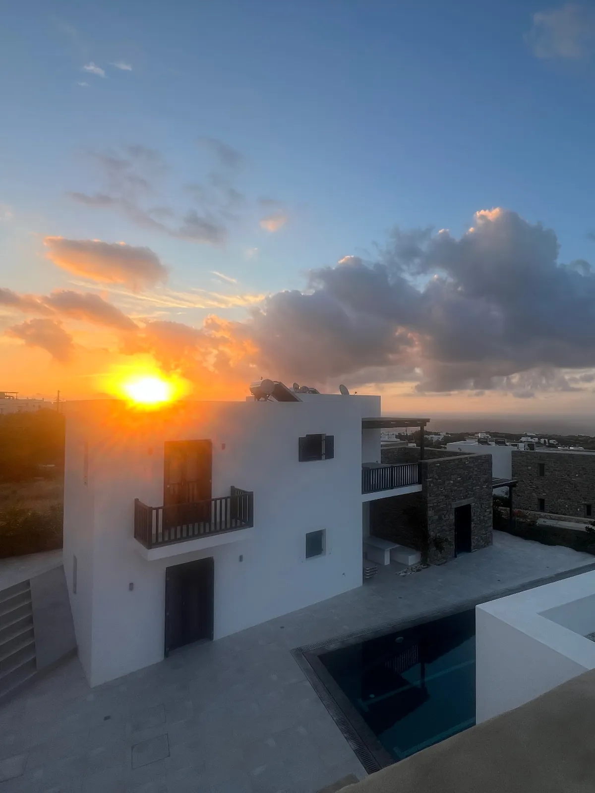 Sky Suite — sunset view over the complex and pool